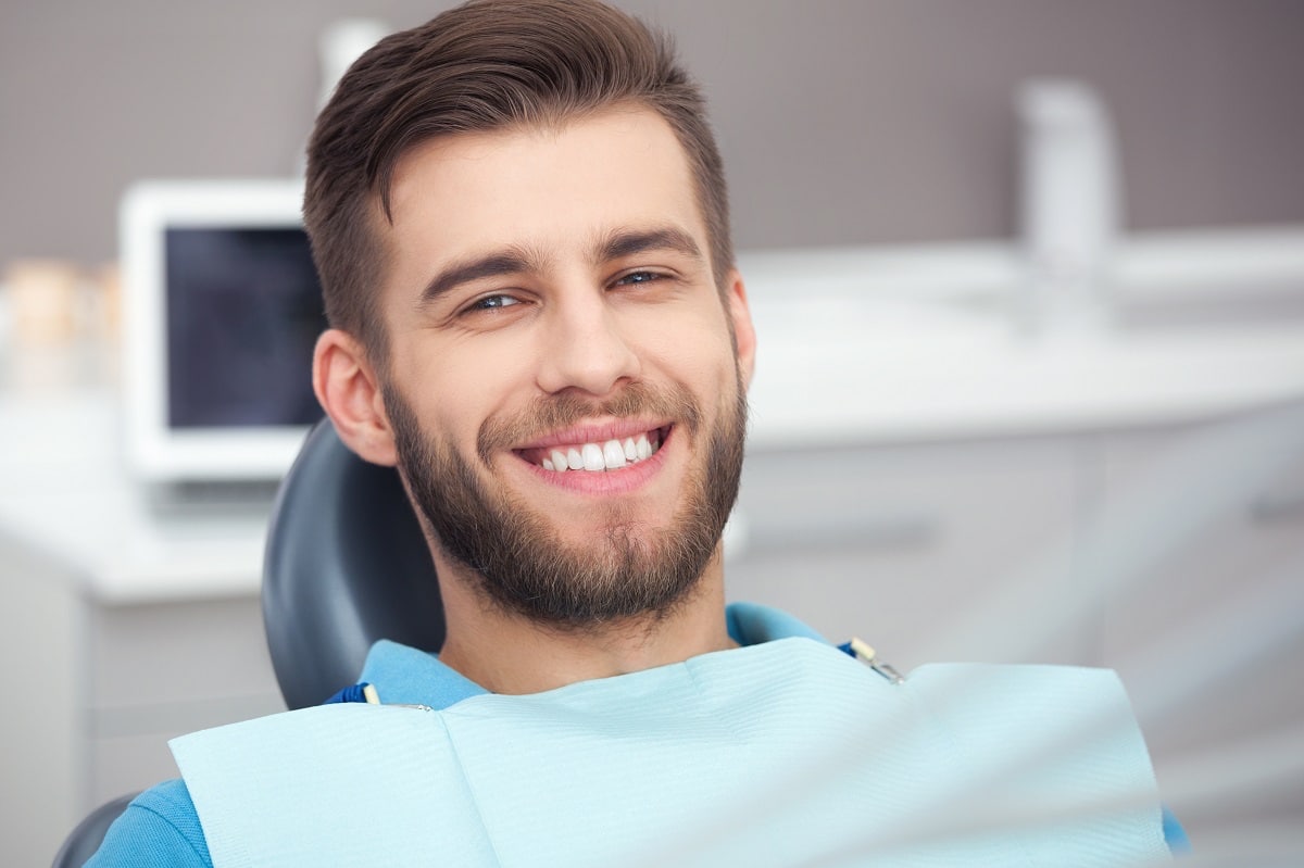 smiling-man-in-dental-chair